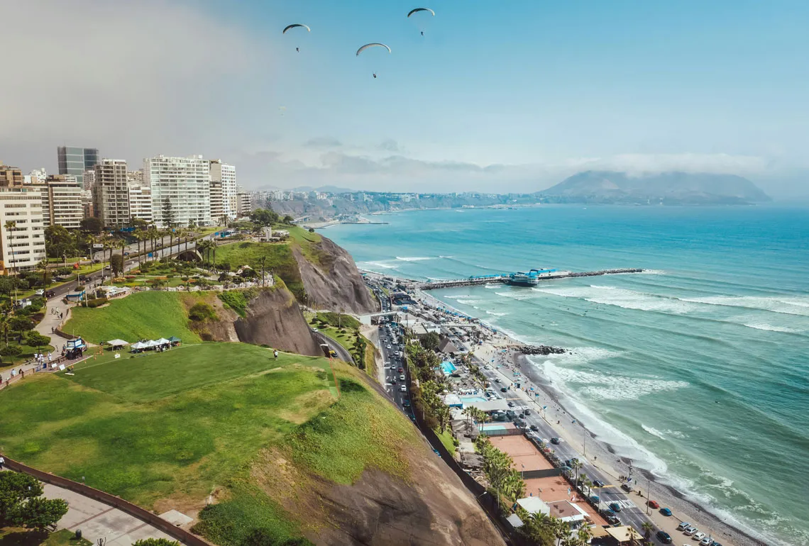 Coastal city with cliffs, beach and Pacific coastline in Peru